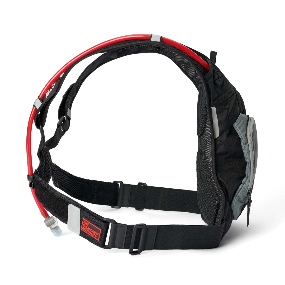 USWE MOTO HYDRO 12L Adventure Fit hydration pack shown from rear angle highlighting elastic shoulder harness with red hydration tube routing, breathable mesh back panel, adjustable waist belt with No Dancing Monkey label, and side storage pocket.